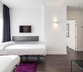 Habitación cuádruple Hotel ILUNION Suites Madrid Habitación cuádruple Hotel ILUNION Suites Madrid